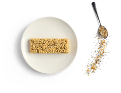 A plate with an unwrapped Optavia Ascend Everything Bagel Bar.